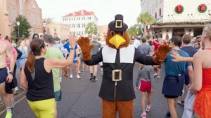 Turkey Mascot high fiving runners